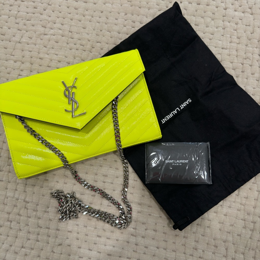 Saint Laurent, patent leather wallet on chain. Excellent condition barely used.